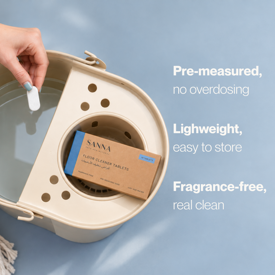 SANNA pre-measured floor cleaner tablet held over a mop bucket, with fragrance-free and space-saving benefits